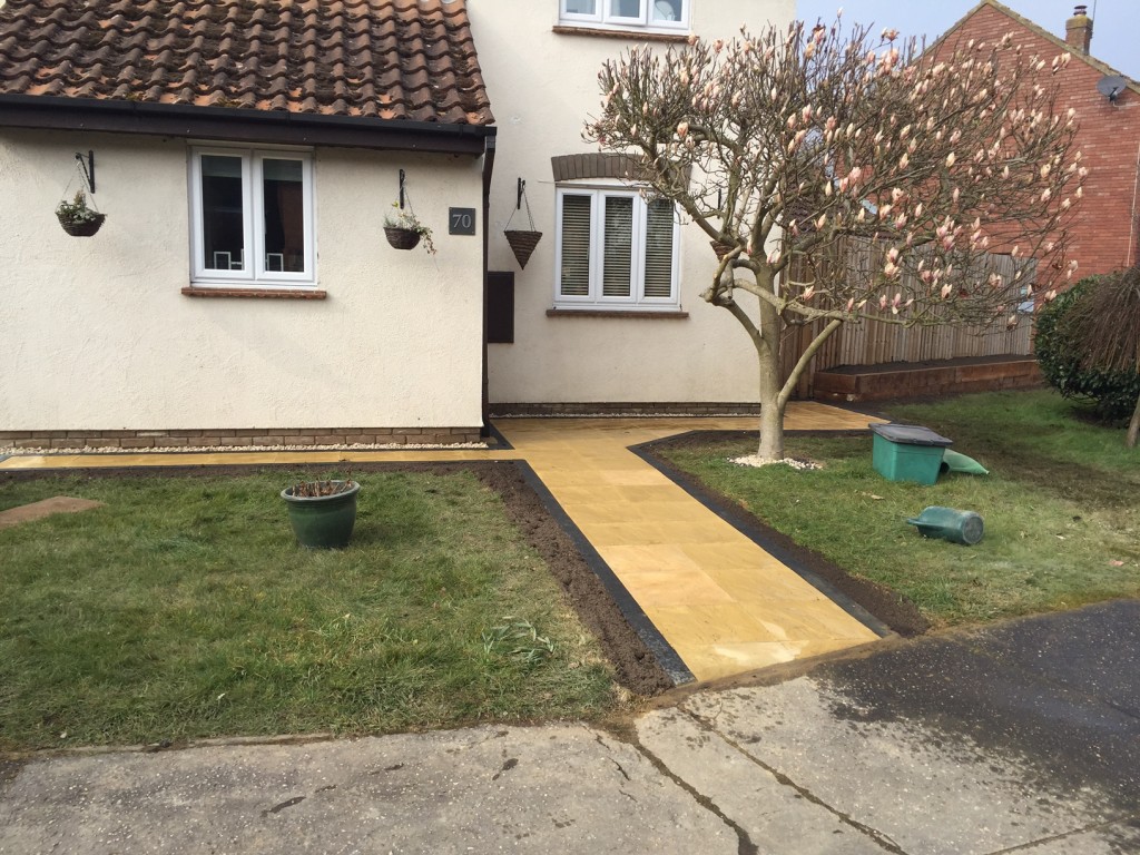 Completed Job using paving slabs with charcoal brick paved edge