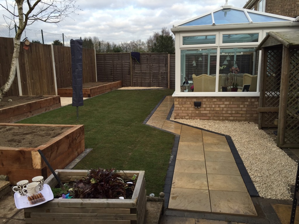 Complete Landscaping Job, with retained flower beds using sleepers, new lawn and new paved pathway.
